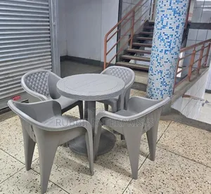 1 Round Table + 4 Molded Plastic Arm Chair