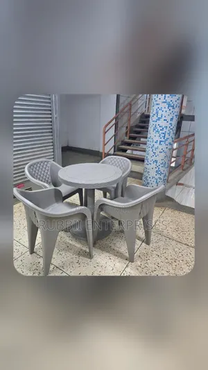 1 Round Table + 4 Molded Plastic Arm Chair