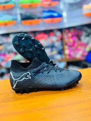 Puma Future 7 Ultimate FG/AG Soccer Cleats in the Black and Silver