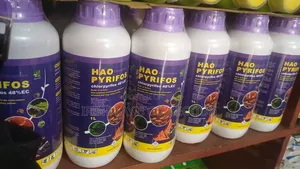 1-Litre White and Purple Bottles of Hao Pyrifos (Chlorpyrifos 48% EC).