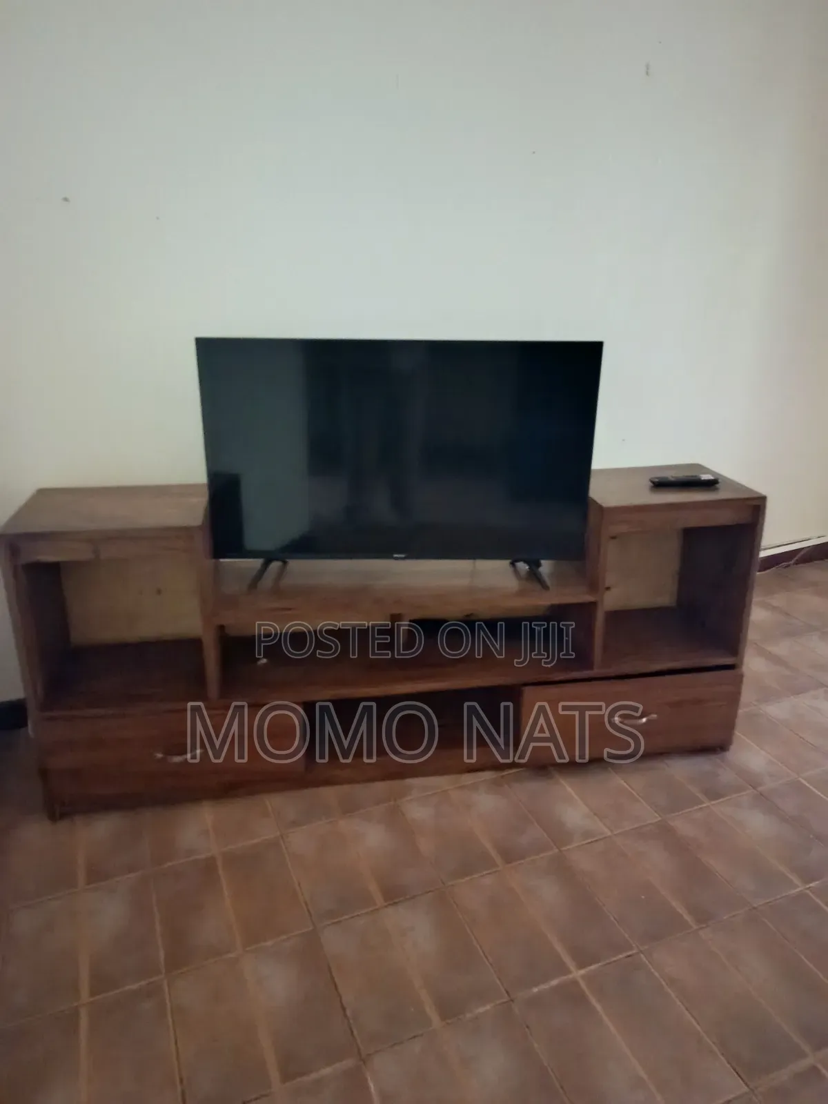 Hisence Smart TV With a TV Stand in Perfect Condition