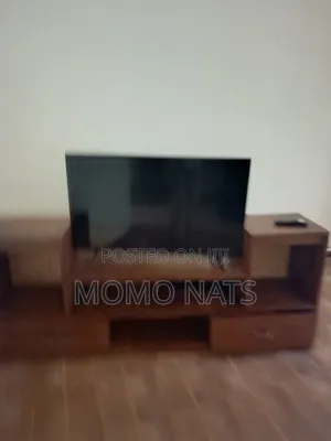 Hisence Smart TV With a TV Stand in Perfect Condition