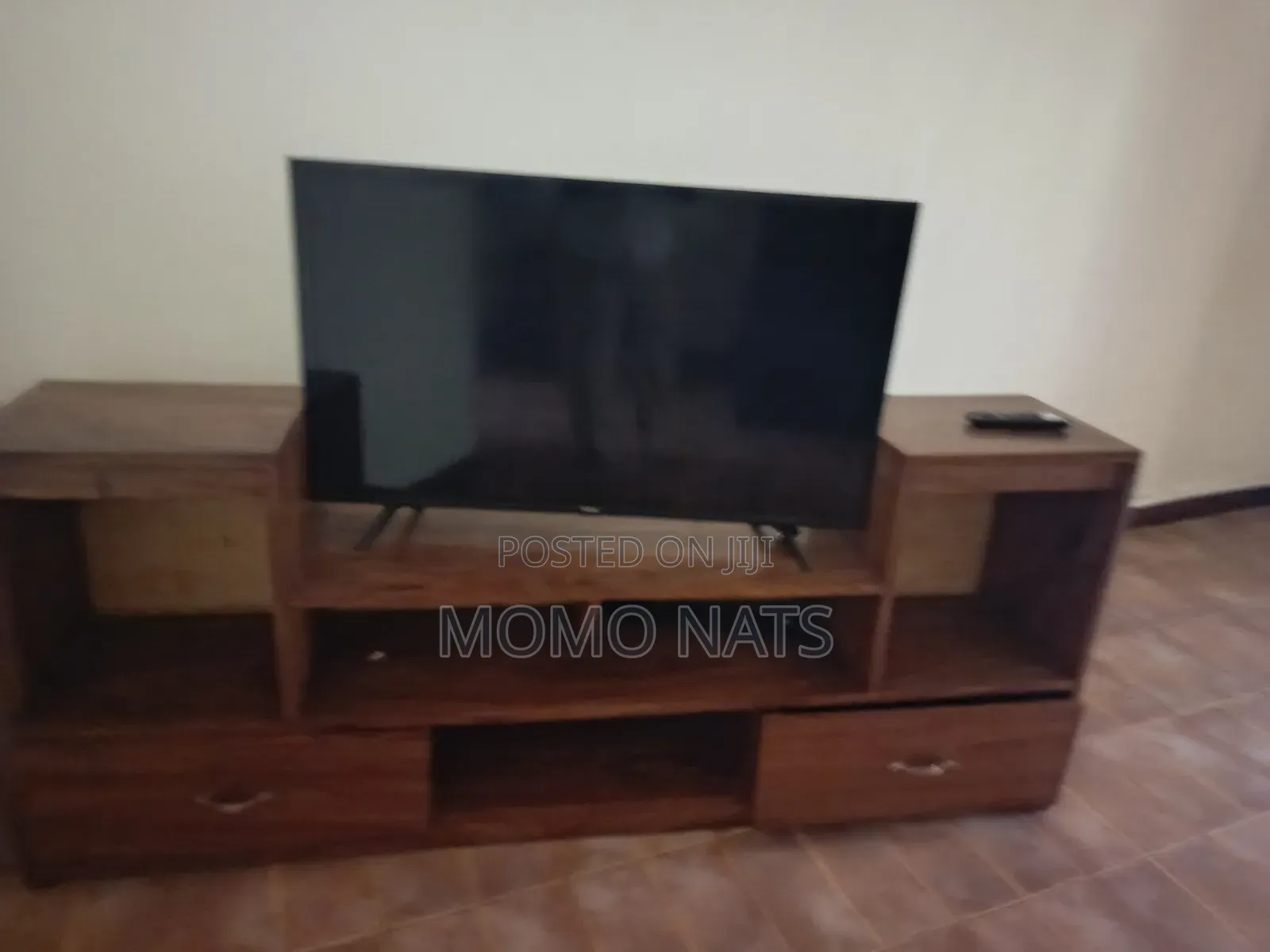 Hisence Smart TV With a TV Stand in Perfect Condition
