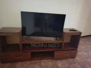 Hisence Smart TV With a TV Stand in Perfect Condition