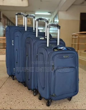 Four-Wheel Set of Navy Blue Softshell Spinner Suitcases
