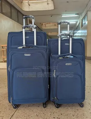 Four-Wheel Set of Navy Blue Softshell Spinner Suitcases