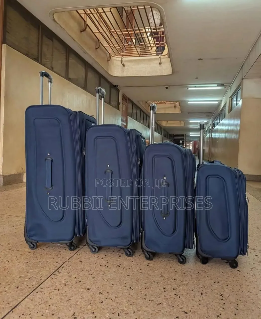 Four-Wheel Set of Navy Blue Softshell Spinner Suitcases