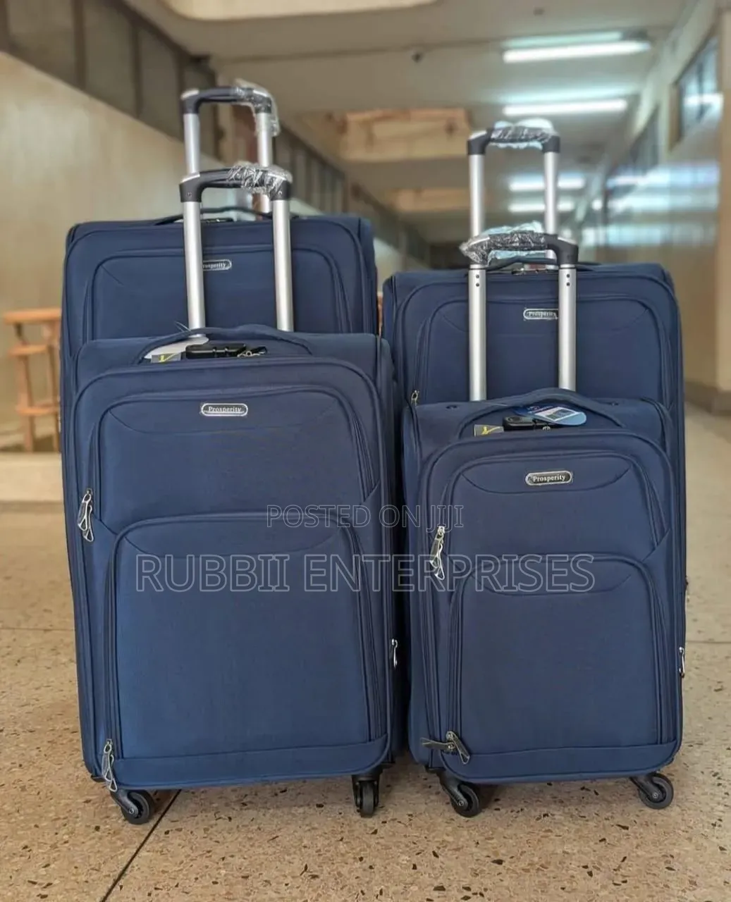 Four-Wheel Set of Navy Blue Softshell Spinner Suitcases