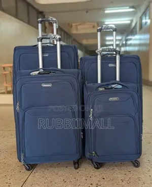 Four-Wheel Set of Navy Blue Softshell Spinner Suitcases