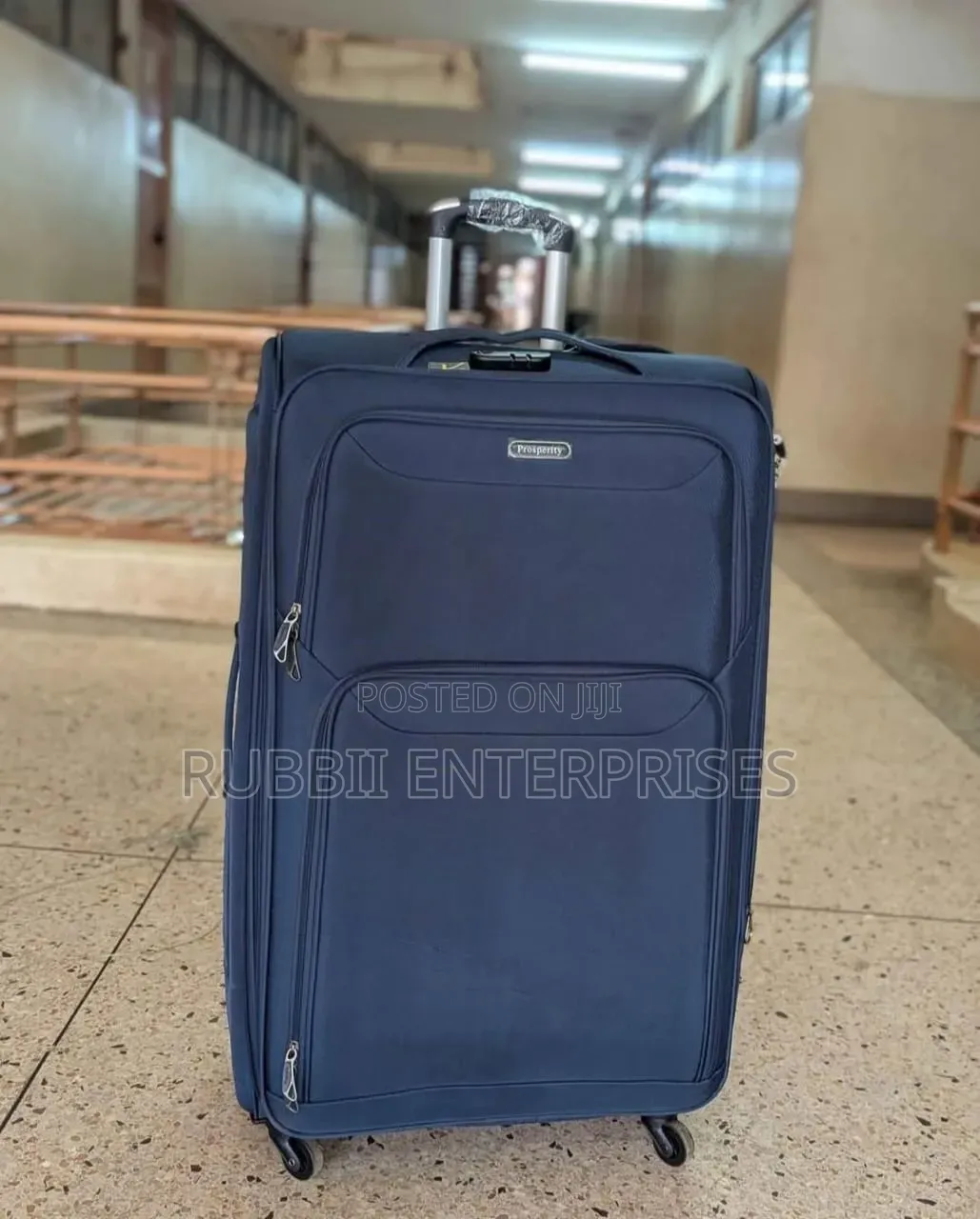 Four-Wheel Set of Navy Blue Softshell Spinner Suitcases