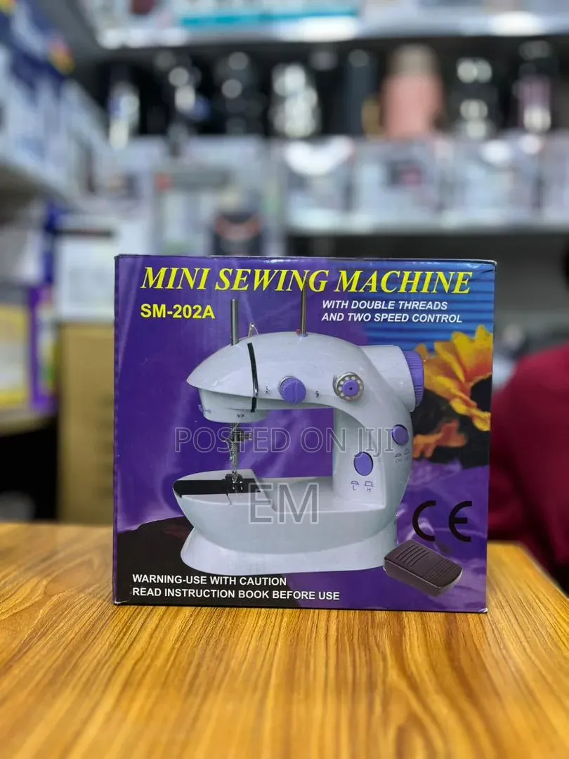 Mini Sewing Machine (Model SM-202A).