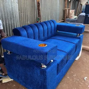 Bright Blue Sofa With Corduroy/Ribbed Fabric Holstery.