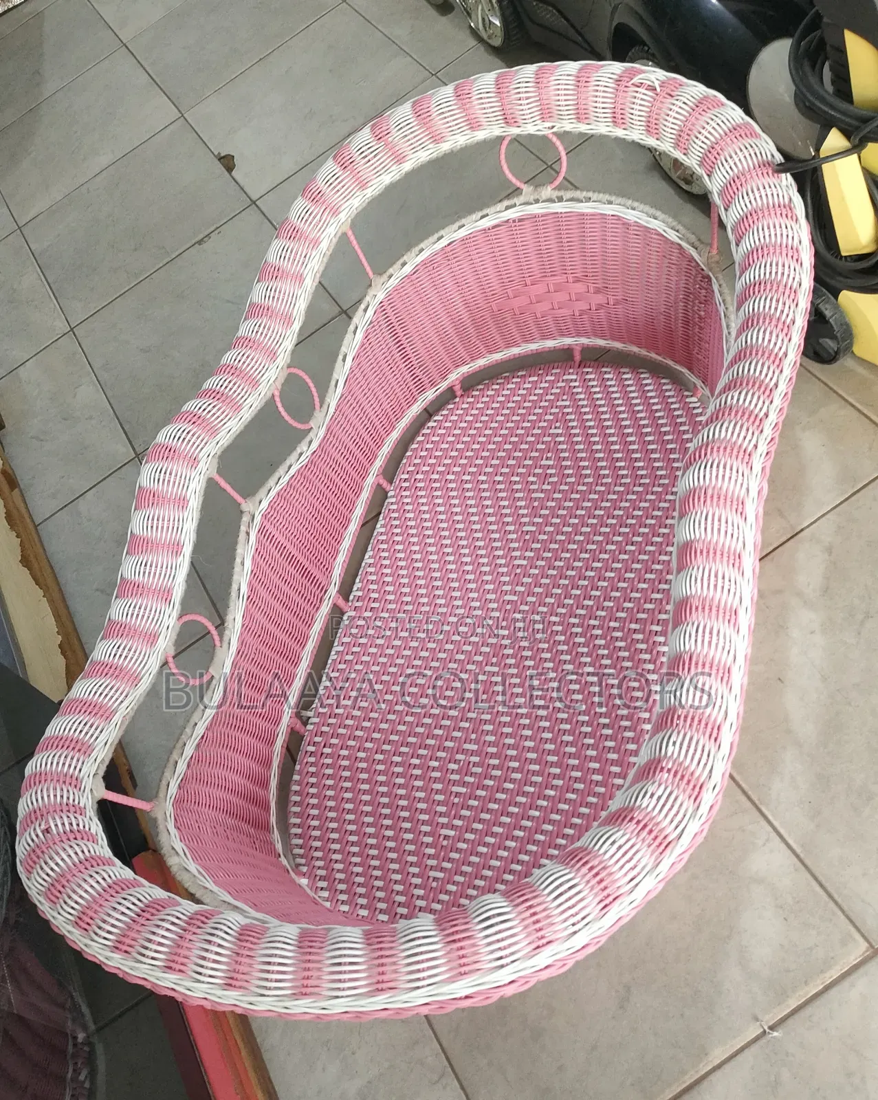 UK Used Pink and White Woven Wicker Baby Bassinet.