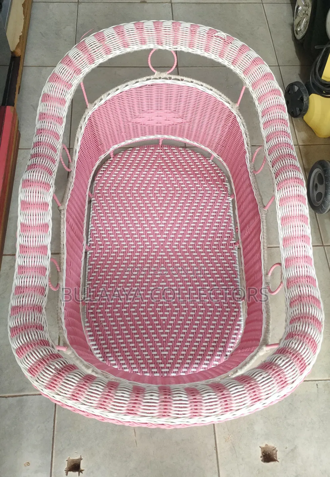 UK Used Pink and White Woven Wicker Baby Bassinet.