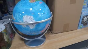World Globe on a Rotating Silver Metal Swivel Stand.