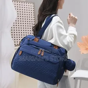 Multi-Functional Diaper Bag Features Brown Leather-Look Accents,