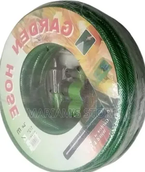 1/2-Inch Green PVC Garden Hose With a Spray Nozzle and Connectors.