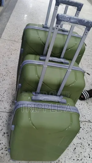 A Set of 3 Nested Olive Green Hard-Shell Rubber Suitcase