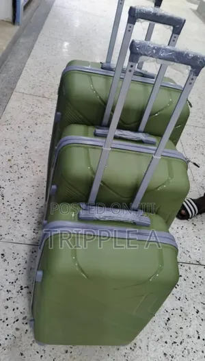 A Set of 3 Nested Olive Green Hard-Shell Rubber Suitcase