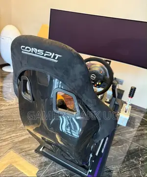 Raching Wheel With Its Gaming Chair and All the Accessories