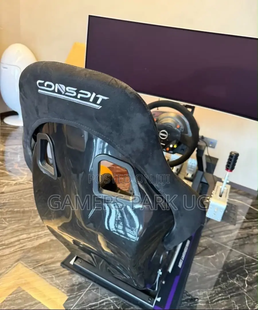 Raching Wheel With Its Gaming Chair and All the Accessories
