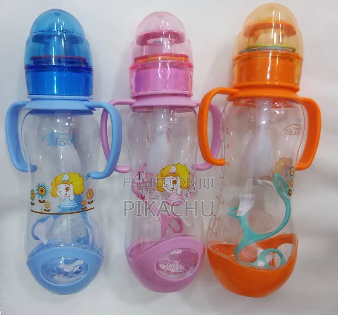 Baby Bottles With Colorful Shakers on the Bottle Top and Spare Nipples
