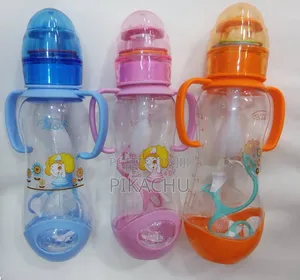 Baby Bottles With Colorful Shakers on the Bottle Top and Spare Nipples