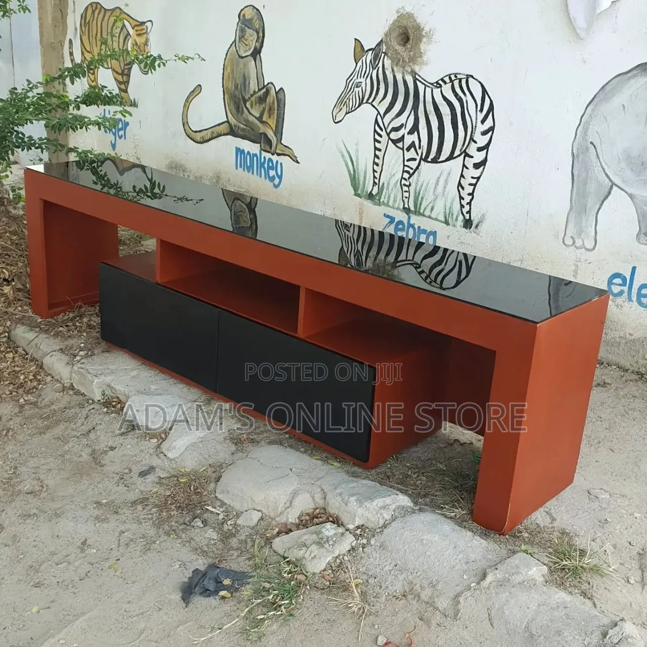 Brown TV Stand Unit With Black Glass on Top