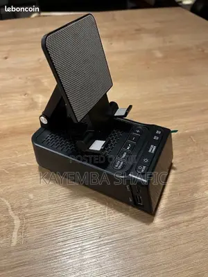 4-in-1 Foldable Phone Stand With Bluetooth Speaker & Clock
