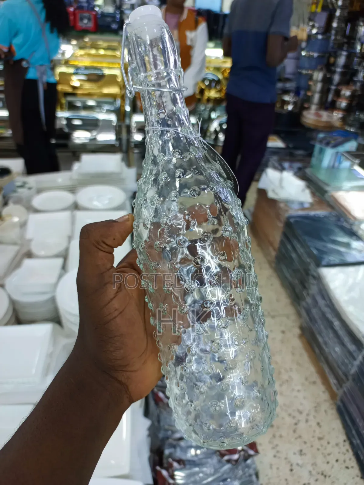 Textured Glass Beverage Bottle With a Swing-Top (Flip-Top) Closure.