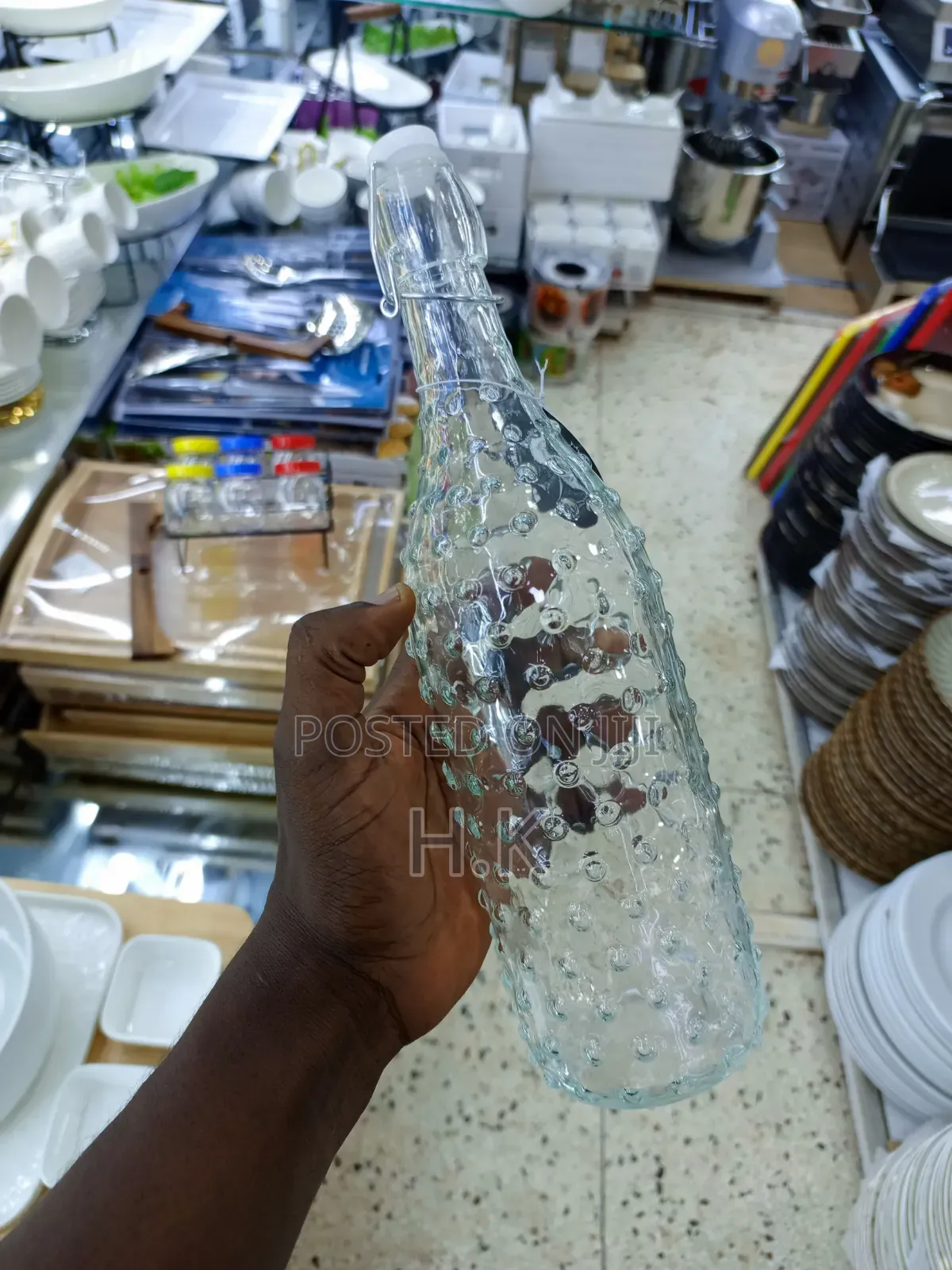 Textured Glass Beverage Bottle With a Swing-Top (Flip-Top) Closure.
