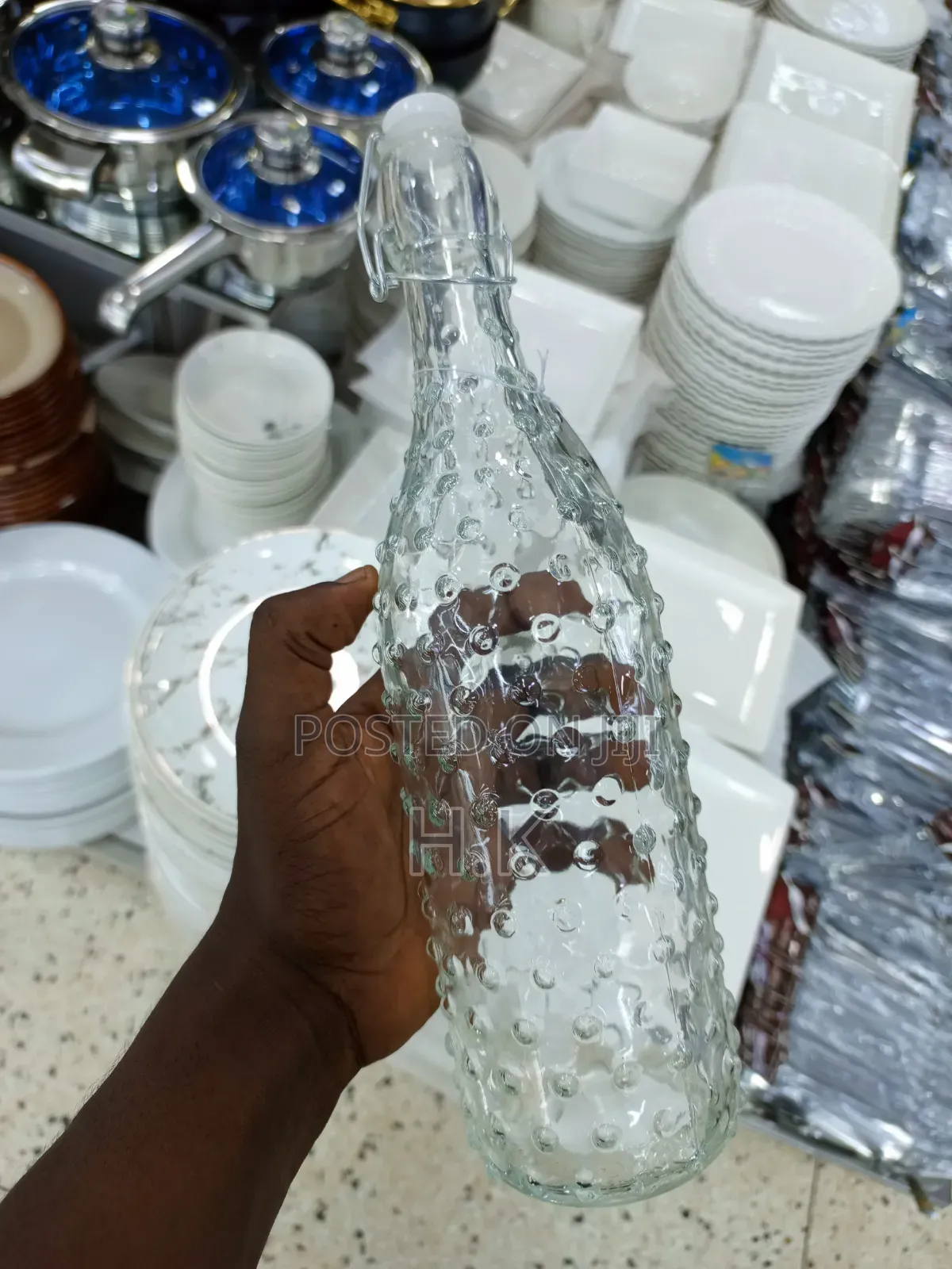 Textured Glass Beverage Bottle With a Swing-Top (Flip-Top) Closure.