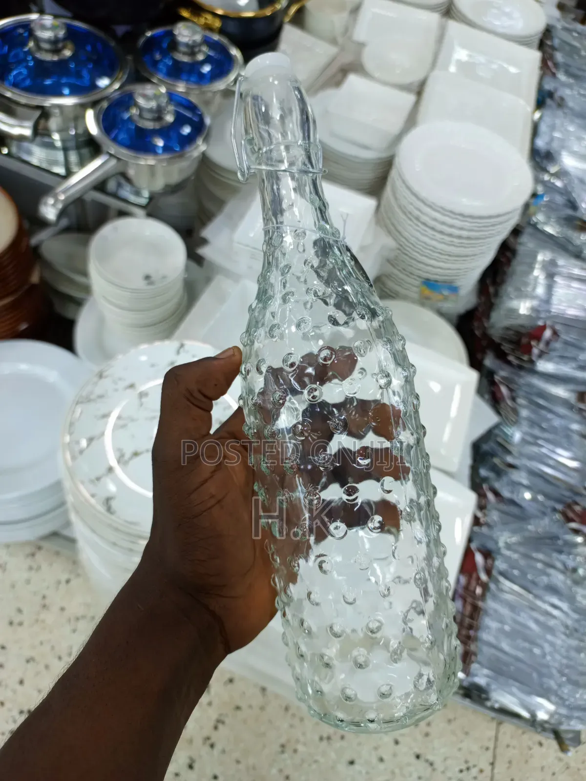 Textured Glass Beverage Bottle With a Swing-Top (Flip-Top) Closure.