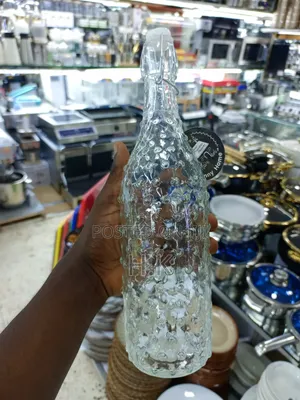 Textured Glass Beverage Bottle With a Swing-Top (Flip-Top) Closure.