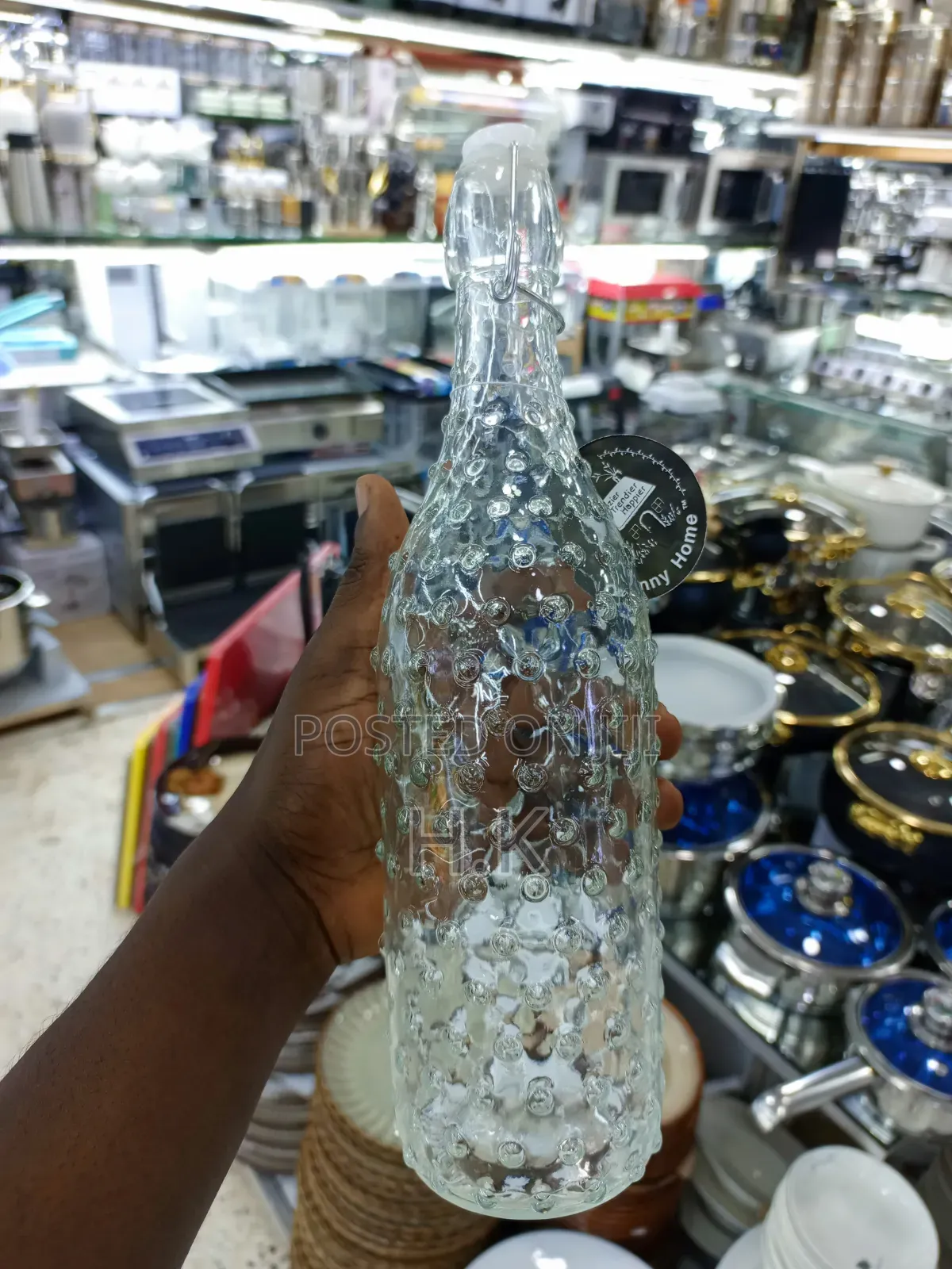 Textured Glass Beverage Bottle With a Swing-Top (Flip-Top) Closure.