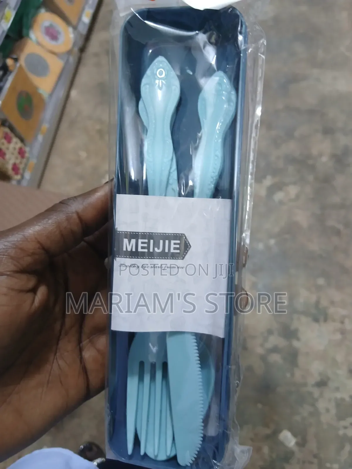 Plastic Travel Cutlery Set Features a Light Blue Spoon, Fork, A