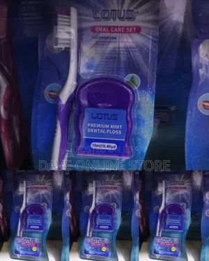 Lotus Oral Care Set Containing a Purple and White Medium Toothbrush