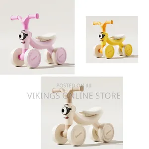 4-Wheel Baby Balance Bike With a Cute Cartoon Face on the Handlebar