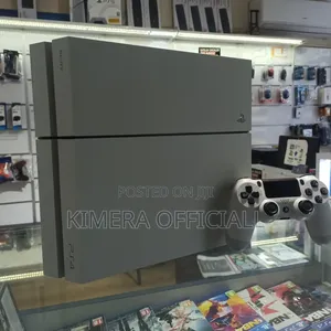 Sony PlayStation 4 Fat Console (Chipped) + 12 Games & 2 Pads – Kampala