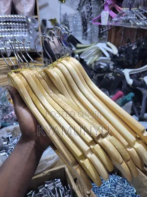 A Dozen Natural Wood Clothes Hangers.