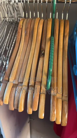 A Dozen Natural Wood Clothes Hangers.