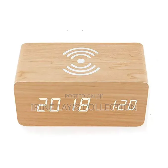 Wooden Digital Alarm Clock With Built-in Wireless Charging Pad on Top.