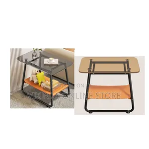 Modern Glass-Top End Table With a Black Metal Frame and an Orange