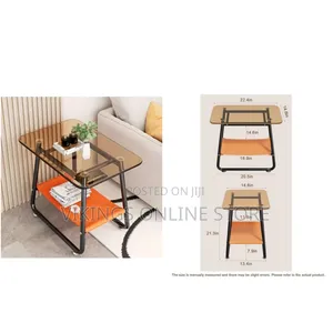 Modern Glass-Top End Table With a Black Metal Frame and an Orange