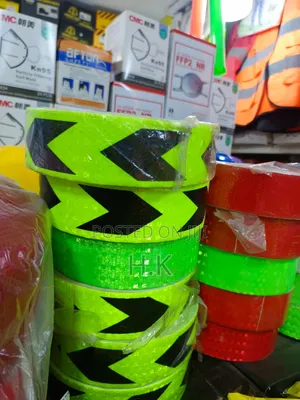 Green and Black Arrow-Pattern Reflective Safety Warning Tape.
