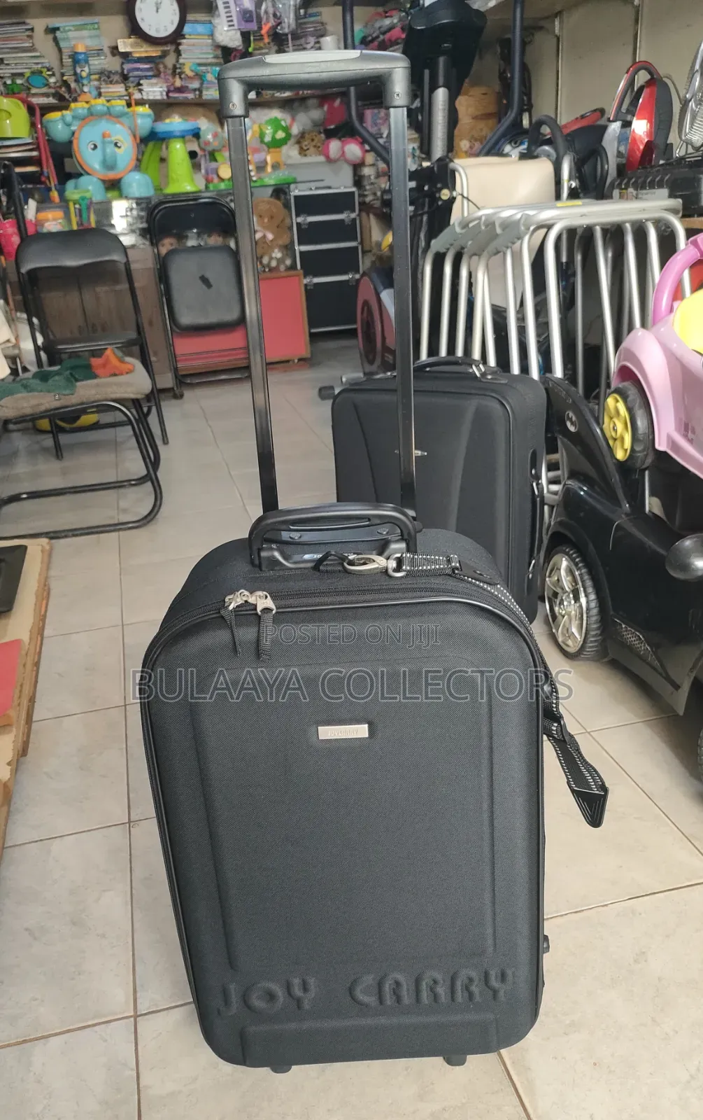 Japanese Joy Carry Black Fabric Medium Size Rolling Suitcase.