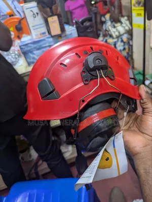 Industrial Safety Helmet With Attached Earmuffs and Ventilation Slots