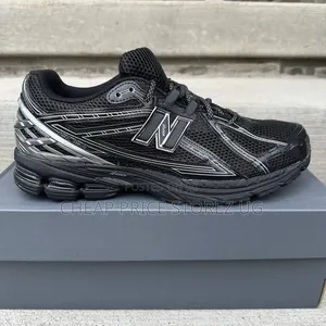 Be a Pair of New Balance 1906R Retro-Tech Running Sneakers