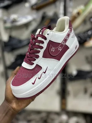 Shows a Custom Nike Air Force 1 Low-Top Sneaker in White and Maroon