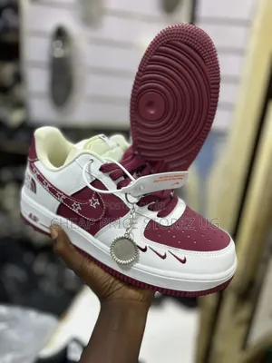 Shows a Custom Nike Air Force 1 Low-Top Sneaker in White and Maroon